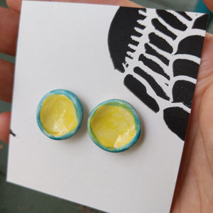 Round ceramic earrings, blue and yellow