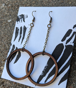 Hoops on chains in lasercut masonite